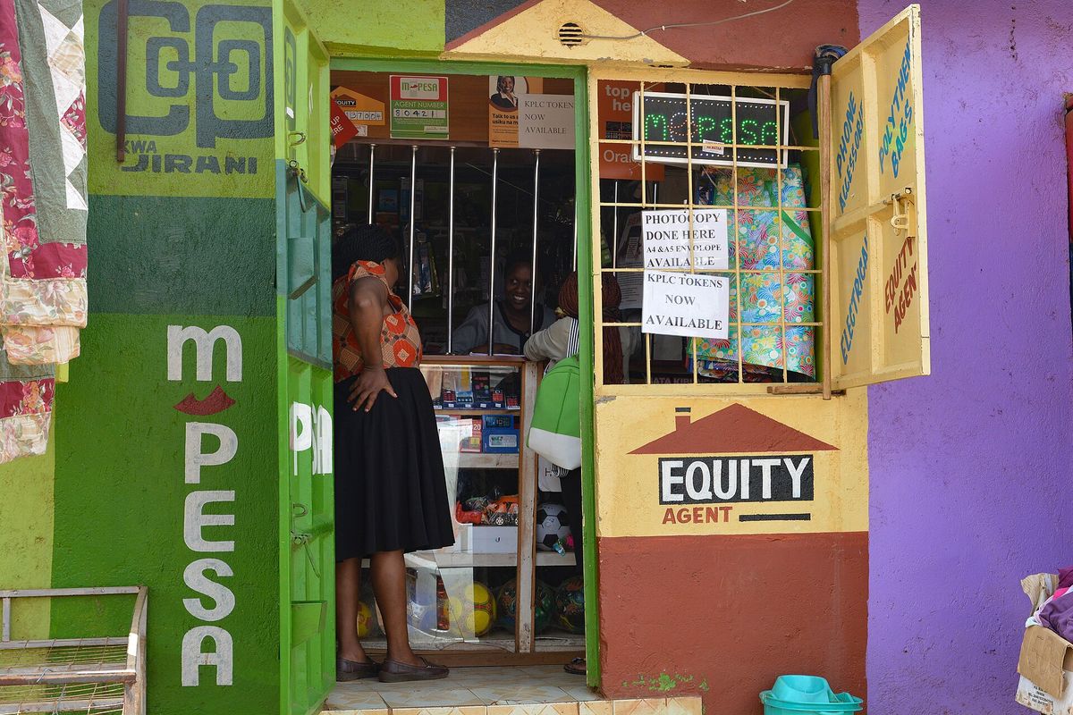 An M-Pesa and Equity Bank agent kiosk on a Nairobi street